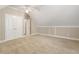 A large carpeted bedroom featuring vaulted ceilings and ample closet space at 110 Wellington Way, Canton, GA 30115