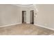 Carpeted bedroom offering access to a closet and room with shelves at 110 Wellington Way, Canton, GA 30115