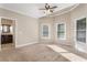 Spacious carpeted bedroom with natural light from large windows at 110 Wellington Way, Canton, GA 30115