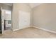 Carpeted bedroom showcasing a double door closet and open doorway at 110 Wellington Way, Canton, GA 30115