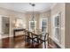 Dining area featuring natural light and hardwood floors, perfect for Gathering meals and entertaining at 110 Wellington Way, Canton, GA 30115