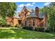Charming two-story brick home with a well-manicured lawn and mature trees in a desirable neighborhood at 110 Wellington Way, Canton, GA 30115
