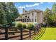 Exterior back view of home with screened in porch and a pool at 110 Wellington Way, Canton, GA 30115