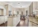 Spacious kitchen with granite island, stainless steel appliances, and adjacent breakfast nook at 110 Wellington Way, Canton, GA 30115