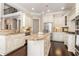 Bright eat-in kitchen with white cabinets, stainless steel appliances, and granite countertops at 110 Wellington Way, Canton, GA 30115