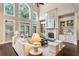 Bright and airy living room with vaulted ceilings, fireplace, built-ins, and hardwood floors at 110 Wellington Way, Canton, GA 30115