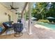 Covered patio with seating and a view of the pool, perfect for outdoor entertaining at 110 Wellington Way, Canton, GA 30115