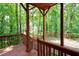 Relax on this private porch with wooden beams overlooking a lush treed backyard at 313 Clubhouse Nw Ct, Kennesaw, GA 30144