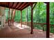 Large wooden deck offering ample room for entertaining with stairs leading to the yard at 313 Clubhouse Nw Ct, Kennesaw, GA 30144
