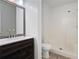Bright bathroom featuring a modern vanity with a decorative mirror and a full-sized shower at 313 Clubhouse Nw Ct, Kennesaw, GA 30144