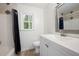 Bathroom featuring a shower-tub combo with a black curtain, and a white vanity at 313 Clubhouse Nw Ct, Kennesaw, GA 30144