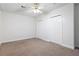 Bedroom featuring neutral walls and carpet, and double closets at 313 Clubhouse Nw Ct, Kennesaw, GA 30144