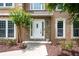 Close-up of an inviting doorway framed by stone accents and meticulously landscaped details at 313 Clubhouse Nw Ct, Kennesaw, GA 30144