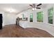 Eat-in kitchen with modern ceiling fan, stainless appliances, and lots of natural light at 313 Clubhouse Nw Ct, Kennesaw, GA 30144