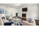 Relaxing living room featuring fireplace, modern decor, and a bright, airy feel at 313 Clubhouse Nw Ct, Kennesaw, GA 30144