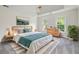 Serene main bedroom featuring tray ceiling, soft natural light, and stylish furnishings at 313 Clubhouse Nw Ct, Kennesaw, GA 30144