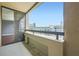 A condo balcony with sliding glass doors that lead inside and views of the surrounding area at 3481 Lakeside Ne Dr # 1107, Atlanta, GA 30326