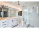 Modern bathroom featuring a vanity with marble countertop, a large mirror, and a glass-enclosed shower at 3481 Lakeside Ne Dr # 1107, Atlanta, GA 30326