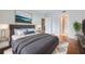 Beautifully staged bedroom featuring a large bed, stylish decor, and an open doorway at 3481 Lakeside Ne Dr # 1107, Atlanta, GA 30326