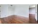 Bedroom showcasing hardwood floors, a spacious closet, and an open doorway to another room at 3481 Lakeside Ne Dr # 1107, Atlanta, GA 30326