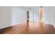 Bedroom with hardwood floors, neutral walls, and a view into other rooms of the home at 3481 Lakeside Ne Dr # 1107, Atlanta, GA 30326