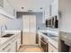 Stylish kitchen with stainless steel appliances, ample counter space and gray painted walls at 3481 Lakeside Ne Dr # 1107, Atlanta, GA 30326