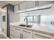 Modern kitchen with white cabinets, stainless steel faucet and marble countertops at 3481 Lakeside Ne Dr # 1107, Atlanta, GA 30326