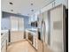Bright kitchen with stainless steel appliances, white cabinetry, and tiled floor at 3481 Lakeside Ne Dr # 1107, Atlanta, GA 30326