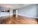 Open-concept living room featuring hardwood floors and a stylish chandelier, with an adjacent kitchen area at 3481 Lakeside Ne Dr # 1107, Atlanta, GA 30326