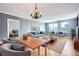 Comfortable living room with city views, sophisticated furniture, and decorative lighting fixtures at 3481 Lakeside Ne Dr # 1107, Atlanta, GA 30326