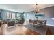 Open living and dining area with modern decor, hardwood floors, and large windows at 3481 Lakeside Ne Dr # 1107, Atlanta, GA 30326