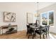 Open dining room with modern chandelier and view to the outside at 1237 Memorial Se Dr # 402, Atlanta, GA 30316