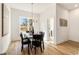 Open dining room with modern chandelier and view to the outside at 1237 Memorial Se Dr # 402, Atlanta, GA 30316
