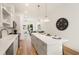 Modern kitchen with island, stainless steel appliances, and view to living area at 1237 Memorial Se Dr # 402, Atlanta, GA 30316