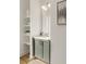 Contemporary powder room with floating shelves and decorative lighting at 1237 Memorial Se Dr # 402, Atlanta, GA 30316