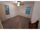 Bright bedroom with neutral walls, ceiling fan, and two windows at 3252 Pinehill Dr, Decatur, GA 30032