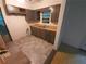 Galley kitchen featuring gray cabinets, a laminate countertop, and a double basin stainless steel sink at 3252 Pinehill Dr, Decatur, GA 30032