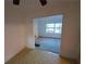 The living room has fresh paint and a doorway that shows another room with a view to the outdoors at 3252 Pinehill Dr, Decatur, GA 30032