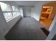 A bright living room featuring ample windows and an open doorway to the kitchen at 3252 Pinehill Dr, Decatur, GA 30032