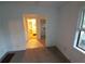 A view of an open concept room featuring fresh paint, a large window, and doorway access at 3252 Pinehill Dr, Decatur, GA 30032