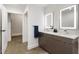 Bathroom featuring double sink vanity, illuminated mirrors, and a contemporary design at 505 Whitehall Sw St # 102, Atlanta, GA 30303