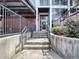 Building entrance includes access stairs, metal railings, and a garden at 505 Whitehall Sw St # 102, Atlanta, GA 30303
