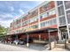 Exterior of the building, featuring exposed brick, multiple windows, and covered parking at 505 Whitehall Sw St # 102, Atlanta, GA 30303