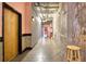 Hallway with concrete floors, exposed brick and ductwork, and dark wood trim at 505 Whitehall Sw St # 102, Atlanta, GA 30303