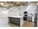 Modern kitchen featuring white cabinets, a kitchen island and stainless steel appliances at 505 Whitehall Sw St # 102, Atlanta, GA 30303
