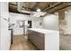 Spacious kitchen features white cabinets, a kitchen island and stainless steel appliances at 505 Whitehall Sw St # 102, Atlanta, GA 30303