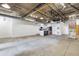 Spacious living room and kitchen area features industrial design elements and concrete floors at 505 Whitehall Sw St # 102, Atlanta, GA 30303