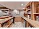 Spacious wet bar with bar seating and plenty of room for storage at 5980 Whitestone Ln, Suwanee, GA 30024