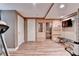 Finished basement features a wood-paneled sauna, work out bench, and luxury vinyl flooring at 5980 Whitestone Ln, Suwanee, GA 30024