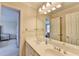 Bathroom featuring a double sink vanity, large mirror, and modern fixtures at 5980 Whitestone Ln, Suwanee, GA 30024